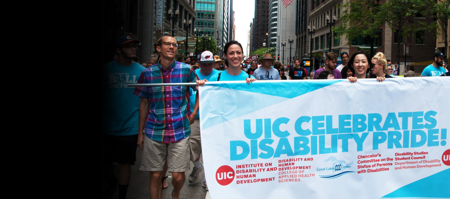 DHD group at the Disability Pride Parade with a banner "UIC Celebrates Disability Pride!" 