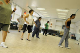 A group of seniors participating in a dance class led by an EPL instructor